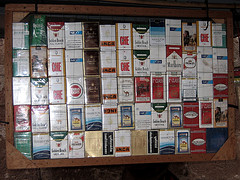 wall of different cigarette brand boxes