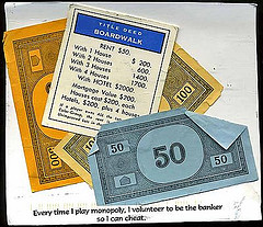 images of monopoly game money and property deeds